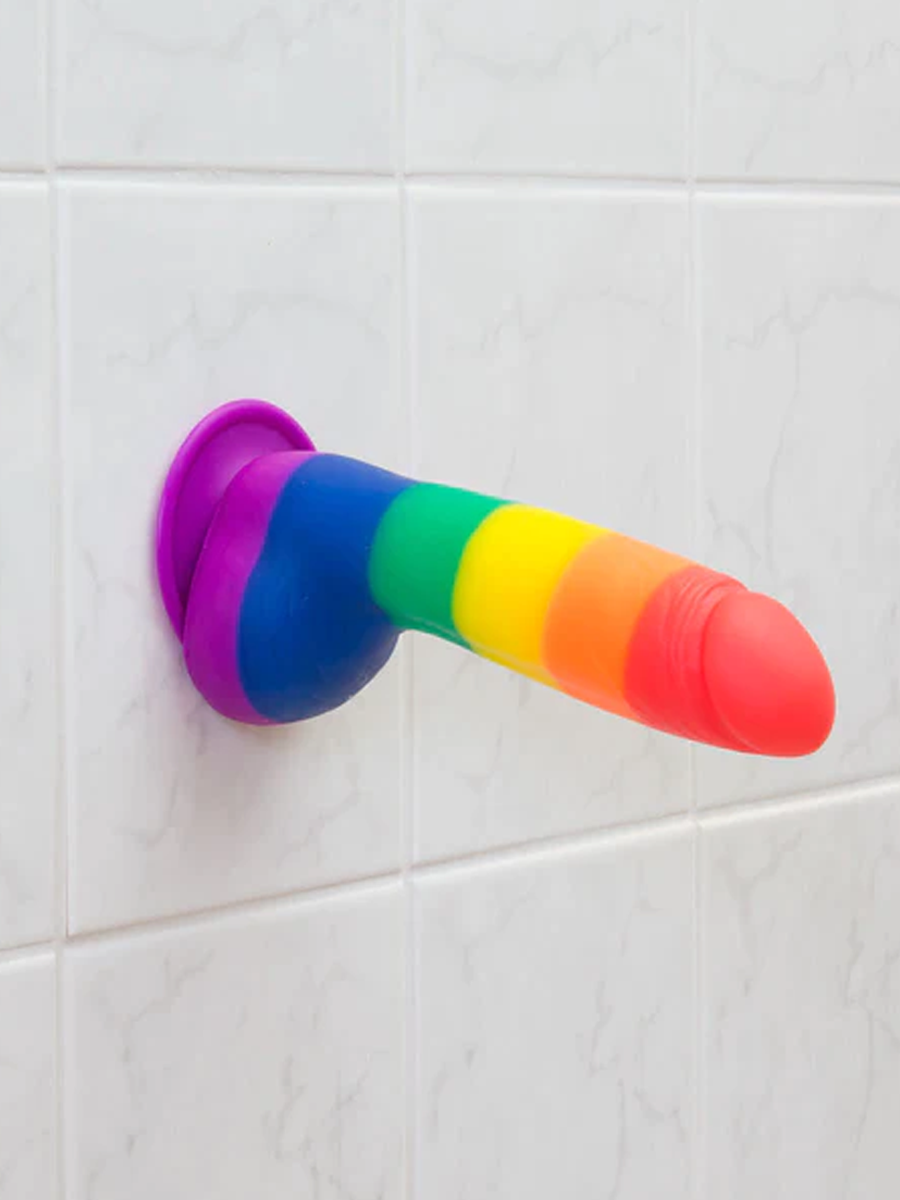 Big Gay Dildo affixed to tile wall